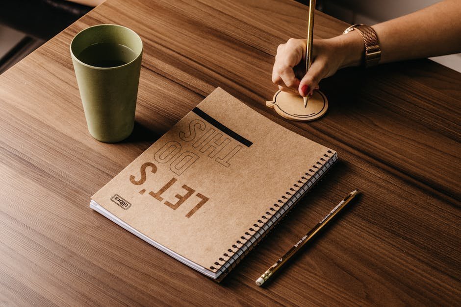 Notebook and pen with handwritten therapy goals on a wooden desk
