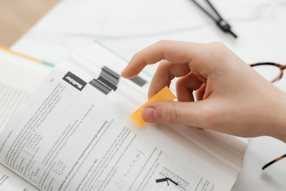 Employee handbook with bookmark on the FMLA section