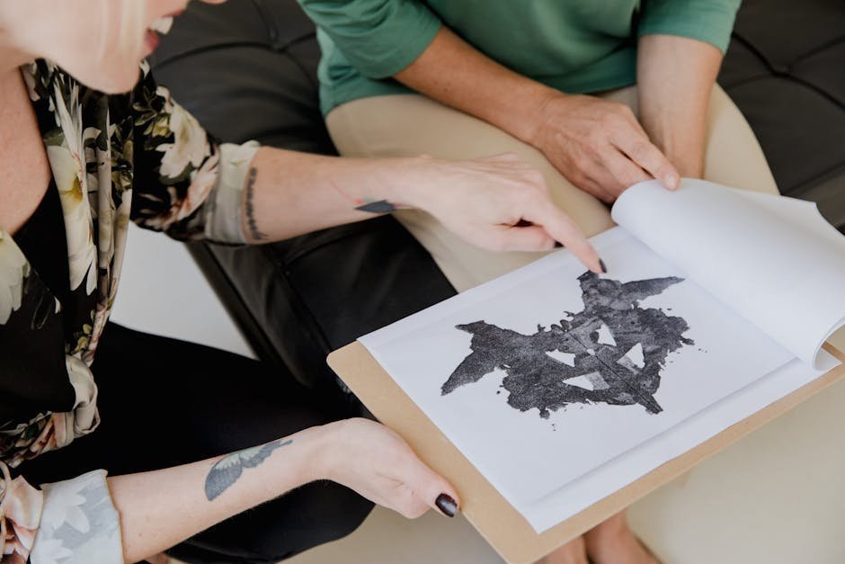 Patient working with a clinician on a cognitive rehabilitation worksheet