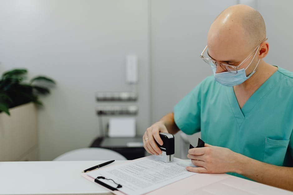 Stack of medical paperwork and insurance documents on a desk