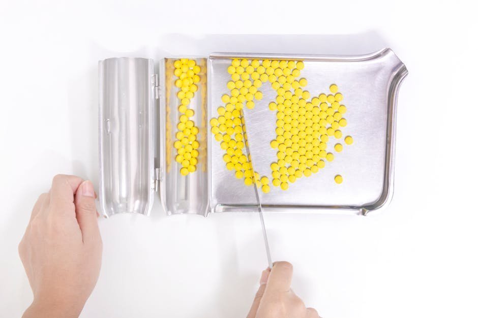 Compounding pharmacist using milligram-precision scale to weigh small dose of diazepam tablets