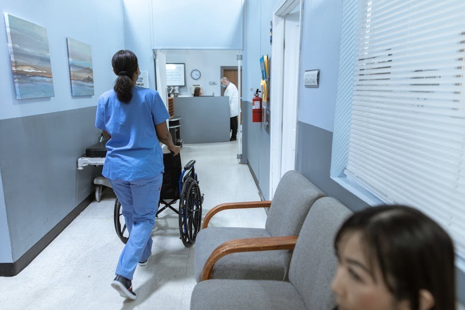 Inpatient psychiatric unit hallway with patient room doors and nursing station for medication management