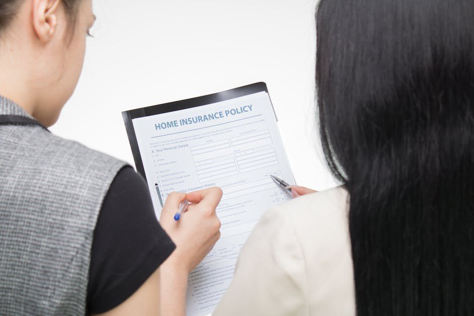 Hospital social worker reviewing insurance authorization paperwork for psychiatric admission with family members