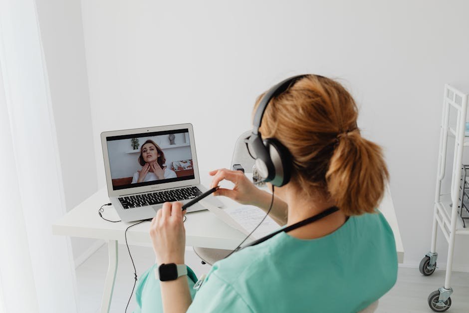 Service member on a video telehealth call with a behavioral health provider from a home office