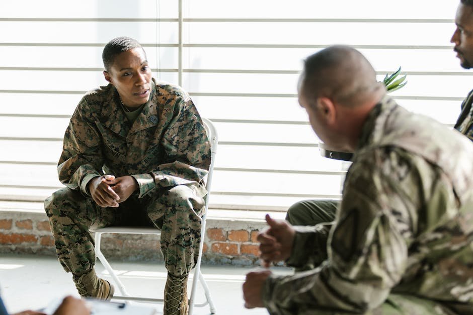 Female veteran in supportive group therapy session with women only military sexual trauma program
