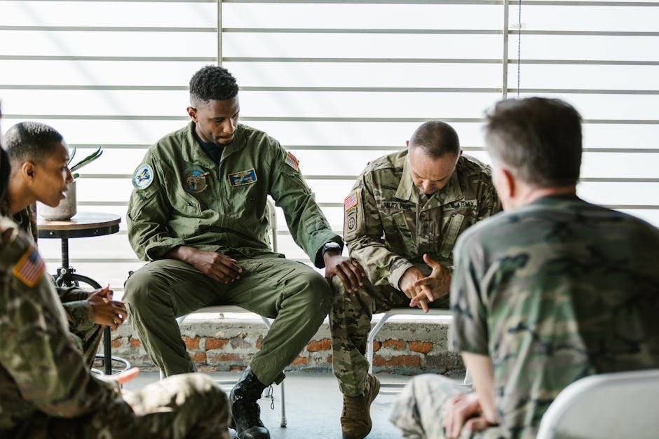 Group of men in peer support meeting talking openly in community center