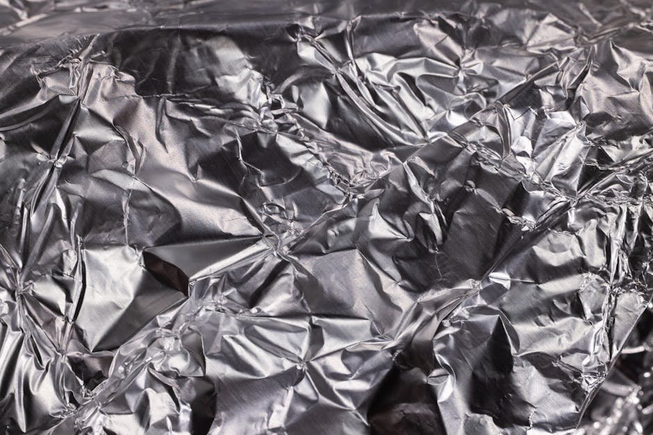 Foil packets of synthetic cannabinoid products on a counter, demonstrating misleading packaging