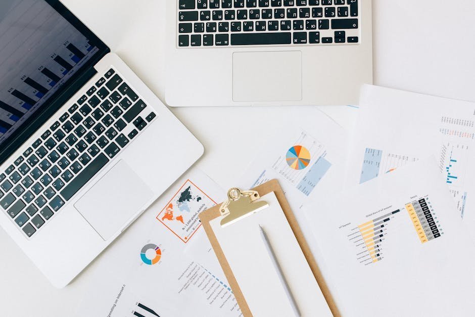 Primary care mental health screening paperwork: a calm desk with a clipboard, a laptop, and a notebook, the quiet setup behind a five-minute depression and anxiety check at a wellness visit